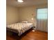 A cozy bedroom with hardwood floors and natural lighting at 2990 Piedmont Dr, Marietta, GA 30066