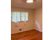 An interior shot of a bedroom with hardwood floors and natural light at 2990 Piedmont Dr, Marietta, GA 30066