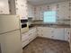 Functional kitchen with white cabinets, updated appliances, and ample counter space at 2990 Piedmont Dr, Marietta, GA 30066