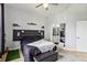This contemporary bedroom boasts sleek furniture, hardwood floors, and a doorway view into a bathroom at 390 17Th Nw St # 6055, Atlanta, GA 30363