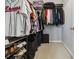 Well-organized walk-in closet with shelving for shoes, hanging rods for clothes, and ample storage space at 390 17Th Nw St # 6055, Atlanta, GA 30363