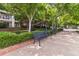 Relaxing common area with benches and greenery provides a serene outdoor space for residents and guests at 390 17Th Nw St # 6055, Atlanta, GA 30363