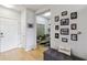 Inviting entryway features hardwood floors and a gallery wall leading to a cozy living space at 390 17Th Nw St # 6055, Atlanta, GA 30363