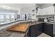 Kitchen with granite countertops, stainless appliances, and a view of the living room at 390 17Th Nw St # 6055, Atlanta, GA 30363