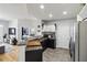 Modern kitchen view featuring granite countertops, stainless appliances, and wood floors at 390 17Th Nw St # 6055, Atlanta, GA 30363