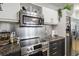 This modern kitchen includes stainless steel appliances, granite countertops, and sleek cabinets at 390 17Th Nw St # 6055, Atlanta, GA 30363