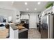 Modern kitchen features wood-style flooring, stainless steel appliances and granite countertop at 390 17Th Nw St # 6055, Atlanta, GA 30363