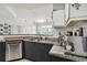 This kitchen features granite countertops, stainless steel appliances, and a stylish design at 390 17Th Nw St # 6055, Atlanta, GA 30363