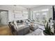 Inviting living room featuring a plush sectional sofa, contemporary decor, and balcony access for seamless indoor-outdoor living at 390 17Th Nw St # 6055, Atlanta, GA 30363