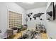 Bright sitting room featuring hardwood floors, seating arrangement, world map wall art, and natural light at 390 17Th Nw St # 6055, Atlanta, GA 30363