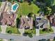 Overhead view of a lovely home with a swimming pool, green backyard, and well-kept landscaping at 4050 Bonnett Creek Ln, Hoschton, GA 30548