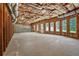 Spacious unfinished basement with multiple windows, exposed ceiling, and potential for customization at 4050 Bonnett Creek Ln, Hoschton, GA 30548