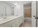 Well-lit bathroom with dual sinks, spacious vanity, and a shower-tub combo at 4050 Bonnett Creek Ln, Hoschton, GA 30548