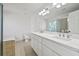 Bright bathroom with dual sinks, a soaking tub, and luxurious finishes at 4050 Bonnett Creek Ln, Hoschton, GA 30548