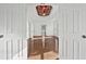 Bright bedroom showcasing hardwood floors, tray ceilings, recessed lighting, and natural light at 4050 Bonnett Creek Ln, Hoschton, GA 30548