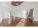 Bright, open bedroom boasting hardwood floors and easy access to the staircase at 4050 Bonnett Creek Ln, Hoschton, GA 30548