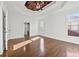 Spacious bedroom featuring hardwood floors, a ceiling fan, and natural light at 4050 Bonnett Creek Ln, Hoschton, GA 30548