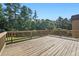 Large wooden deck perfect for outdoor entertaining with stunning views at 4050 Bonnett Creek Ln, Hoschton, GA 30548