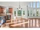 Bright kitchen with center island, hardwood floors, and large windows with backyard views at 4050 Bonnett Creek Ln, Hoschton, GA 30548