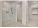 Clean and modern bathroom featuring a glass-enclosed shower and walk-in closet at 7310 Winderlea Ln, Cumming, GA 30040
