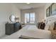 Serene bedroom features neutral decor, natural light, and comfortable furnishings at 7310 Winderlea Ln, Cumming, GA 30040