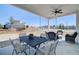 Inviting covered patio with an outdoor dining set and comfortable seating area, perfect for relaxation and entertaining at 7310 Winderlea Ln, Cumming, GA 30040