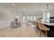Open-concept living area with ample seating, dining space, and a view of the kitchen at 7310 Winderlea Ln, Cumming, GA 30040