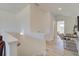 Open loft features a modern table with woven chairs, stylish lighting, and wood floors at 7310 Winderlea Ln, Cumming, GA 30040