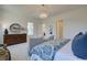 Spacious bedroom with a large dresser and blue bedding, creating a tranquil retreat at 7310 Winderlea Ln, Cumming, GA 30040