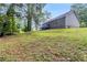 Large backyard with a deck and beautiful surroundings at 112 Laguna Springs Dr, Woodstock, GA 30188