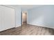 Cozy bedroom features wood-look floors and a double closet, offering ample storage at 112 Laguna Springs Dr, Woodstock, GA 30188
