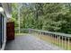 Spacious deck overlooking the wooded back yard at 112 Laguna Springs Dr, Woodstock, GA 30188