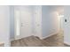 Home foyer with light blue walls and light wood grain floors at 112 Laguna Springs Dr, Woodstock, GA 30188