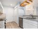 Well-appointed kitchen featuring granite countertops, stainless steel appliances, and a hanging pot rack at 112 Laguna Springs Dr, Woodstock, GA 30188
