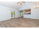 Sun-filled living room showcases an open floor plan with access to the kitchen and outdoor space at 112 Laguna Springs Dr, Woodstock, GA 30188