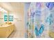 Bright bathroom featuring a vanity and a shower with a playful, beach-themed curtain adding personality at 130 Brooklet Way, Brooks, GA 30205