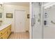 Bright bathroom featuring tile flooring, a double-door closet, and a walk-in shower with safety grab bars at 130 Brooklet Way, Brooks, GA 30205