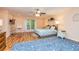 Large primary bedroom featuring hardwood floors, a queen-sized bed, and natural light at 130 Brooklet Way, Brooks, GA 30205