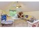 Cozy bedroom with vaulted ceilings, a ceiling fan, and natural light from the large window at 130 Brooklet Way, Brooks, GA 30205
