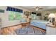 Cozy bedroom with hardwood floors, natural light from windows, and blue accent decor at 130 Brooklet Way, Brooks, GA 30205