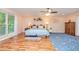 Spacious bedroom with hardwood floors, a large window, and a comfortable queen-sized bed at 130 Brooklet Way, Brooks, GA 30205