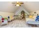 Bright bedroom featuring vaulted ceilings, cozy seating, and natural light at 130 Brooklet Way, Brooks, GA 30205