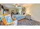 Serene bedroom with hardwood floors, natural light from windows, and light blue accents at 130 Brooklet Way, Brooks, GA 30205