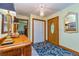 A welcoming foyer features a wooden front door, tile floor, and closet at 130 Brooklet Way, Brooks, GA 30205