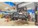 Spacious garage workshop with an automobile lift, tools, and an American flag at 130 Brooklet Way, Brooks, GA 30205