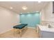 Inviting room with calming blue accent wall, ideal for a spa or treatment space, complemented by modern flooring at 130 Brooklet Way, Brooks, GA 30205