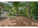 Spacious backyard with plenty of mature trees and room for activities at 4309 King Valley Se Dr, Smyrna, GA 30082
