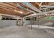 Unfinished basement with concrete floors, exposed duct work and small windows at 4309 King Valley Se Dr, Smyrna, GA 30082
