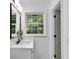 Bright bathroom with view from window and new fixtures at 4309 King Valley Se Dr, Smyrna, GA 30082