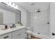 Beautifully updated bathroom featuring marble countertops, modern fixtures, and walk-in shower at 4309 King Valley Se Dr, Smyrna, GA 30082